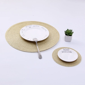 Detail view of round ramie woven placemats in two sizes with spiral texture design