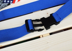 Detail of blue nylon canvas belt with a black industrial plastic quick-release buckle
