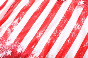 Macro shot of distressed American flag print fabric with stars and stripes texture