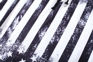 Detailed macro view of distressed star and stripe print fabric with black woven drawstring