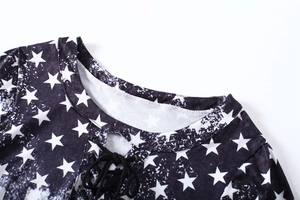 Detail of V-neckline with star print and black lace-up drawstring on women T-shirt