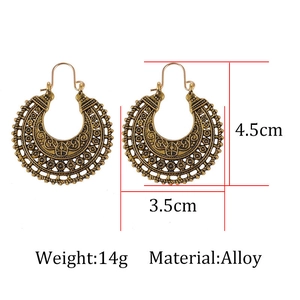 Detail shot of bohemian hollow engraved earrings with dimensions 4.5cm by 3.5cm