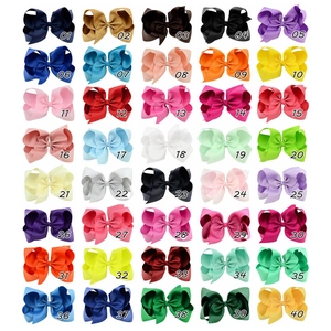 Detalle de lazos para el pelo de 15 cm en cinta de grosgrain con 40 opciones de color sólido