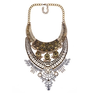 Macro detail of multi-layer statement necklace with crystals and vintage white pearls