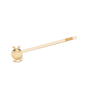Golden owl hair clip set with sparkling rhinestones on a clean white background
