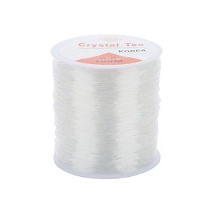 Macro detail of 0.8mm clear elastic bead cord for DIY jewelry making on 100m spool