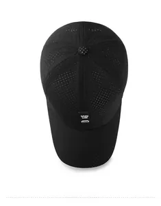 Close-up of black breathable laser-cut mesh fabric and brand label on a baseball cap