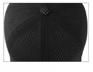 Detailed top view of a black baseball cap featuring mesh fabric and a polka dot button