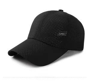 Detail of black sun protection baseball cap with laser-cut breathability holes and side print
