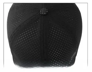 Detail of the black mesh baseball cap showing top button and six-panel stitching construction