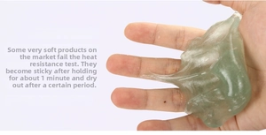 Detail of light green clear putty being stretched showing flexible texture and non-stick grip