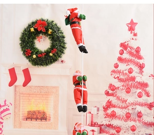 Three Santa Claus climbing on a rope against fireplace and decorated Christmas tree