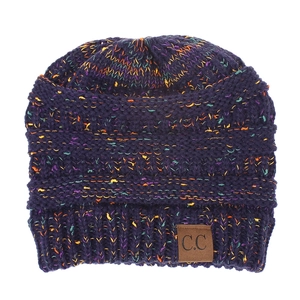 Close-up of thick knit beanie texture with mixed yarn colors and brown C.C leather patch