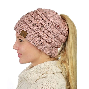 Close-up of pink speckled knit beanie with ponytail hole and leather C.C logo label