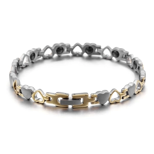 Bracciale magnetico bicolore oro e argento con maglie a cuore per benessere e stile
