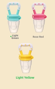 Baby fruit feeders in green, pink, and yellow with star patterns and dust covers