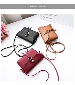 Detailed top view of mini PU leather crossbody bags in black, brown, and burgundy colors