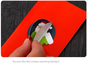 Detail of Christmas greeting card featuring a unique round Santa buckle closure design