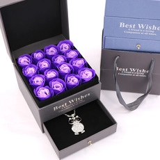 Gray jewelry box featuring 16 purple soap roses and a silver owl pendant necklace
