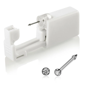 Detail of disposable piercing tool with white plastic applicator and silver rhinestone stud