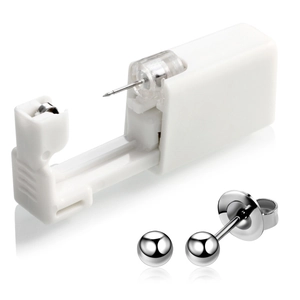 Detailed view of white disposable ear piercing tool with silver polished steel ball studs