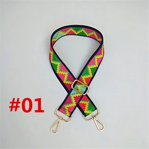 Close-up of colorful ethnic woven strap with gold metal hooks and geometric pattern