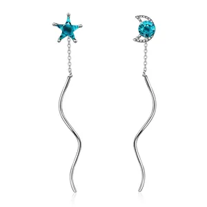 Pendientes largos asimétricos con borlas y piedras azules de estrella y luna plata