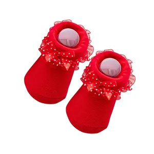 Red cotton infant socks with lace trim and polka dot bow for holiday dressing