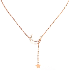 Detail of rose gold Y-necklace featuring a crescent moon and small star pendant