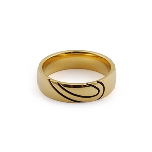 Gold titanium steel heart ring with black enamel heart patterns on a white background