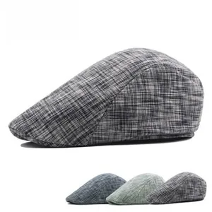 Detailed view of plaid cotton ivy caps in dark grey, blue, green and light grey