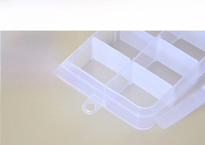 Macro detail of clear plastic jewelry box featuring a built-in hanging hook design