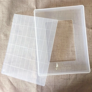 Detailed view of non-stick snowflake cake mold tray and grid marking board set