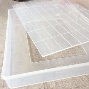 Close-up of non-stick snowflake cake mold grid tray with lid for handmade DIY baking