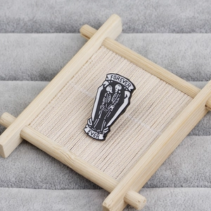 Gothic black coffin enamel pin with kissing skeletons and Forever Ever text banner
