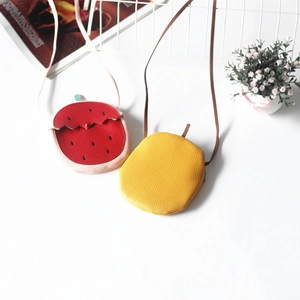 Close-up of kids mini bags featuring lychee grain texture and strawberry design details