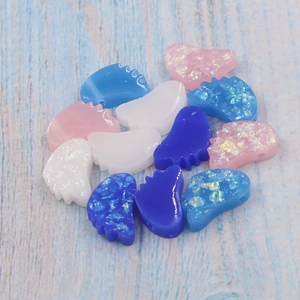 Macro shot of 10mm resin foot-shaped opal beads for DIY jewelry making in assorted colors