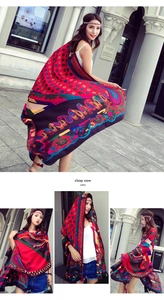 Detail of red bohemian paisley cotton linen shawl with delicate tassel edge finish