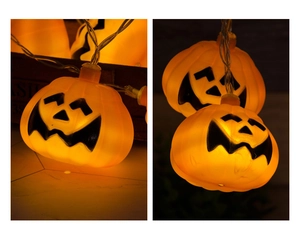 Close-up of warm orange pumpkin LED string lights with jack-o-lantern smiling faces