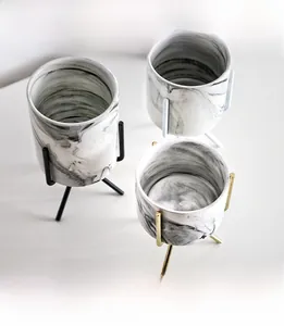 Top view of marble texture ceramic succulent pots with detachable metal plant stands