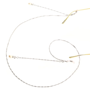 Silver metal eyewear chain with white pearl accents and silicone loops on white background