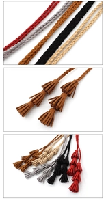 Detail of multi-color woven waist ropes showing suede texture and triple tassels