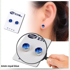 Detailed view of 6mm royal blue magnetic stud earrings with magnified gemstone texture