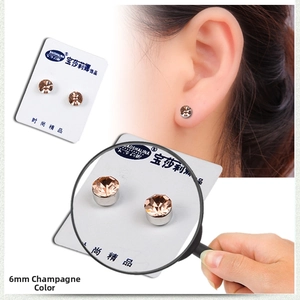 Detail shot of 6mm champagne crystal magnetic stud earrings showing the non-pierced design