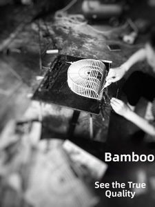 Artistic detail of handcrafted bamboo ark clutch with intricate hollowed woven structure