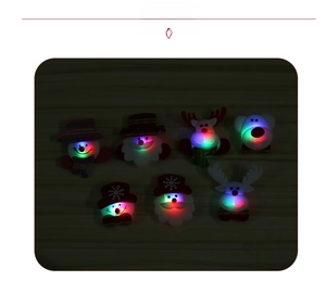 Set of 7 glowing LED Christmas brooches with Santa, Snowman and Reindeer designs