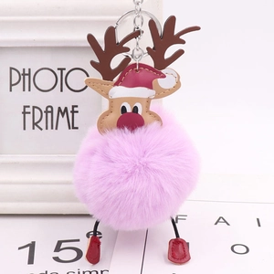 Pink plush reindeer pom pom keychain with red Christmas hat and silver metal ring