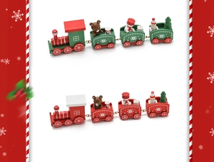 Detail of red and green wooden Christmas train with snowman and bear figurines