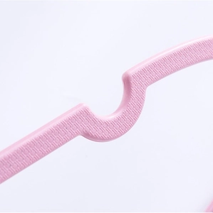 Close-up of pink heart-shaped clothes hanger showing the anti-slip woven texture