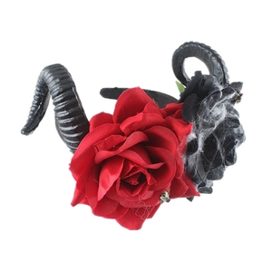 Detail of gothic horn headband with red and black roses plus metal insect accent